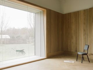 Wood clad interior with large window at Studio Richter Mahr