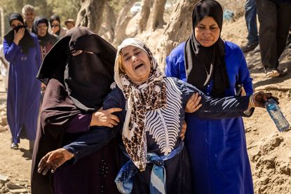 A woman reacts to a relative's death following the Moroccan earthquake