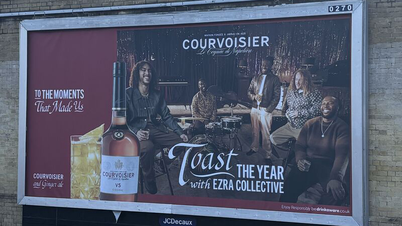 advert that says toast the year with Ezra Collective