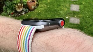 Image shows an Apple Watch 3 with a rainbow bracelet on someone's wrist.