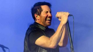 Nine Inch Nails’ Trent Reznor singing onstage