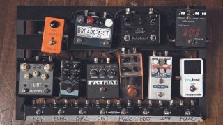 An overhead shot of a pedalboard and pedals