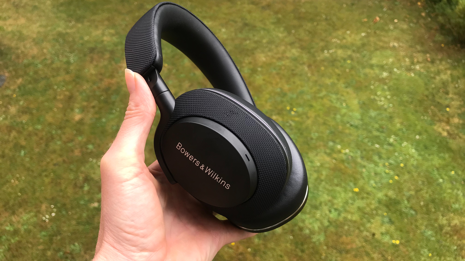 Bowers & Wilkins PX7 S2 at an angle on a green background