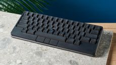 A photo of the HHKB Studio mechanical keyboard on a stone surface