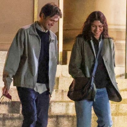 Zendaya and Robert Pattinson on the set of their new movie wearing coordinating jackets