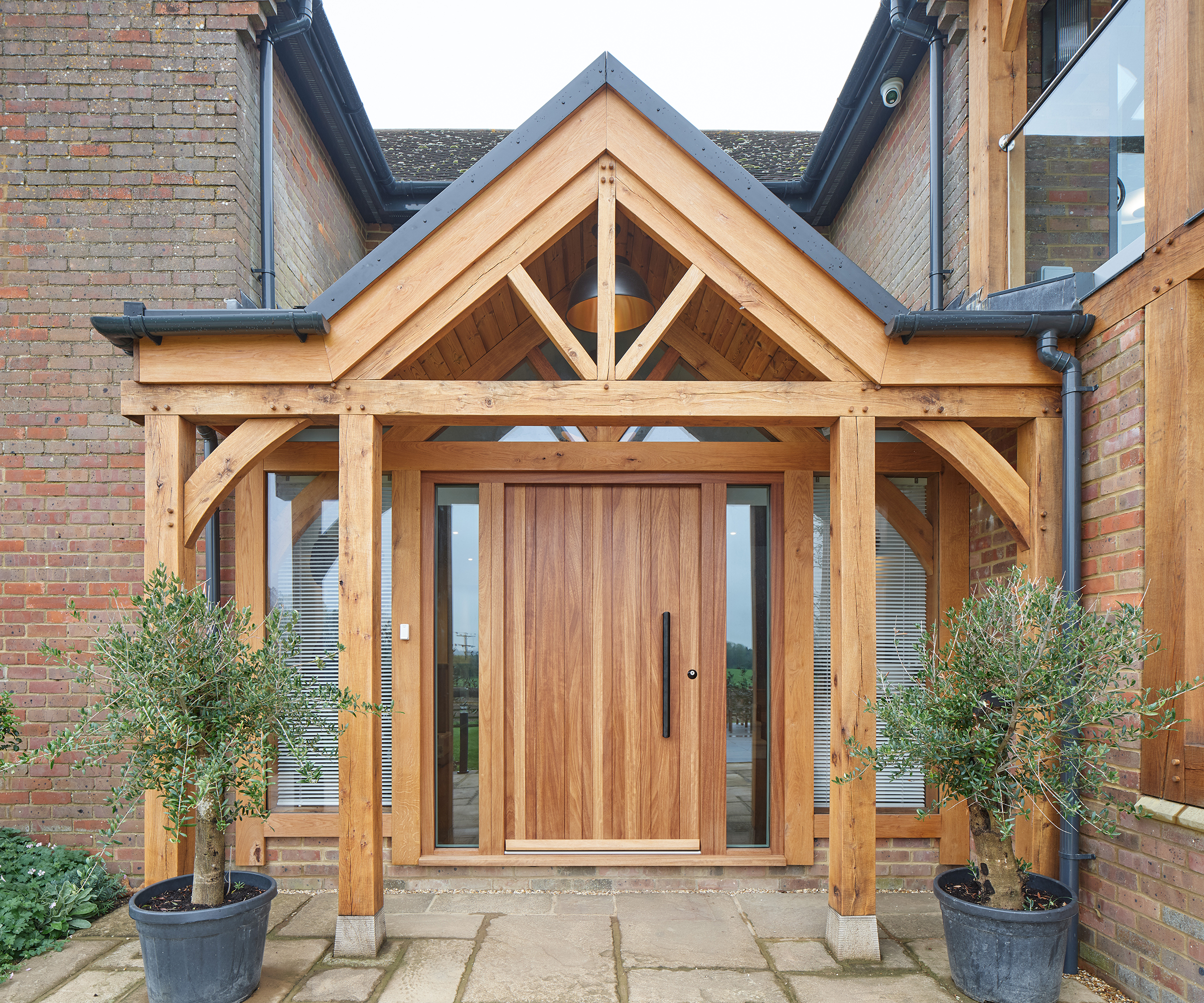 modern oak porch with large oak front door