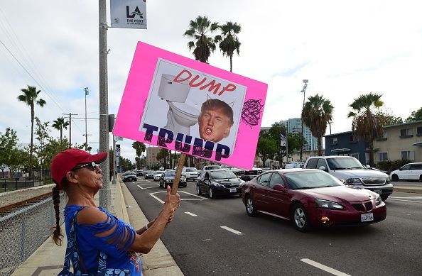 A protester in Los Angeles holds an anti-Donald Trump sign.