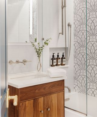 shower room with patterned tiles and vanity unit
