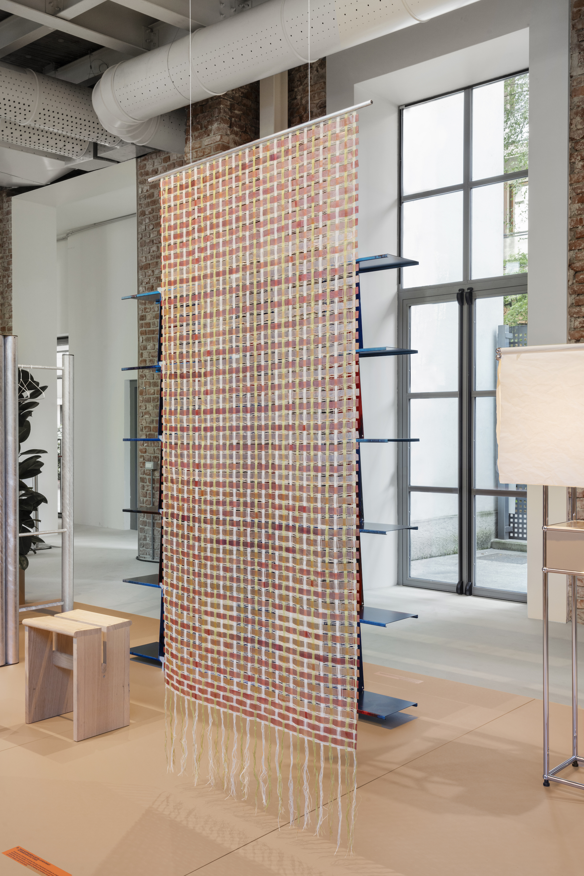 A woven hanging using bacterial cellulose in a gallery setting. 