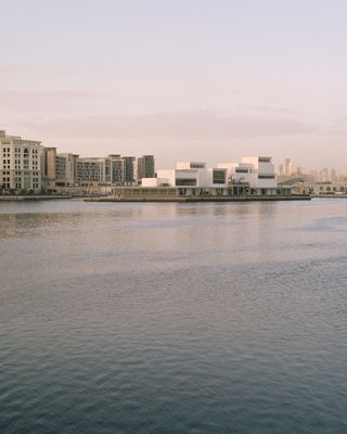 Jameel Arts Centre from the opposite side of the water