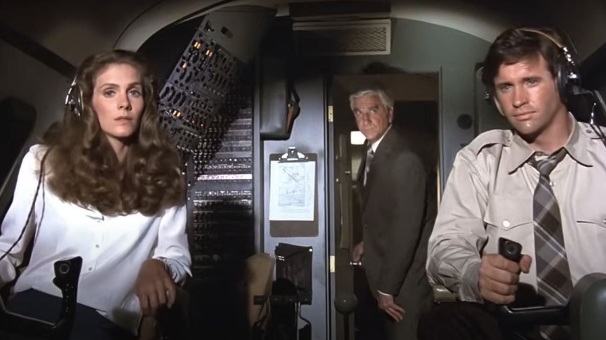 Leslie Nielsen as Dr. Rumack talking to Julie Hagerty as Elaine and Robert Hays as Striker in Airplane!