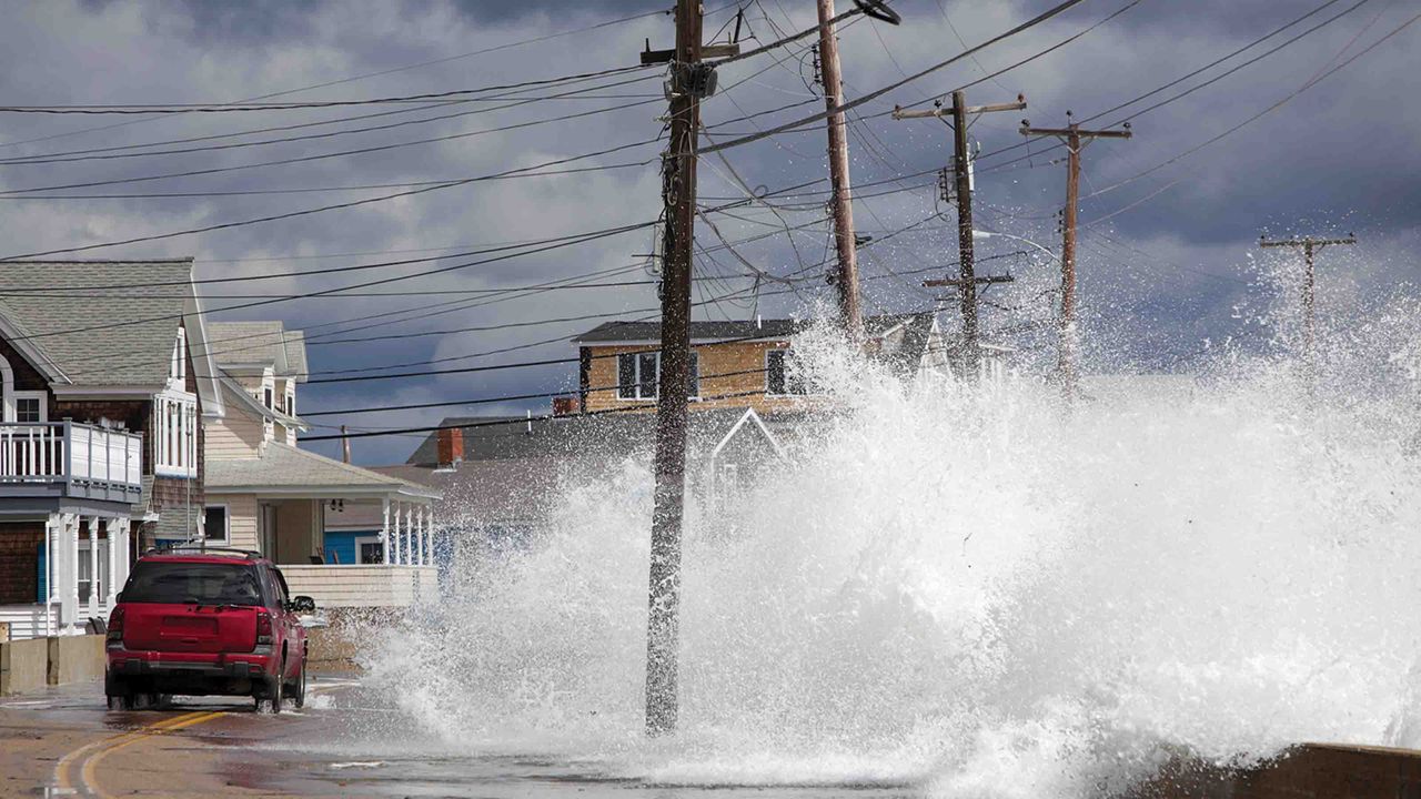 photo of wave crashing on road