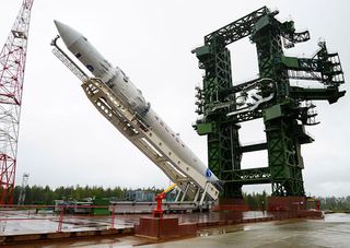 The first Angara rocket is raised into launch position at Russia's Plesetsk Cosmodrome for its maiden launch. The rocket launched a dummy payload on July 9, 2014.