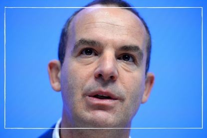 Close up of money saving expert Martin Lewis&#039;s face with a blue background