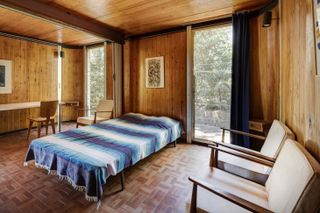 Wood clad interior of modernist Villa by Jean Prouvé & Neil Hutchinson
