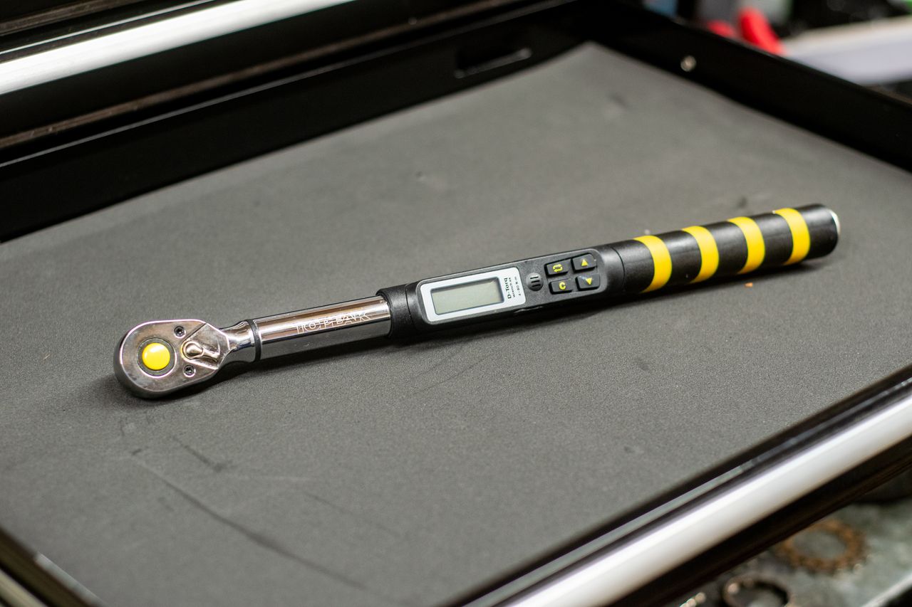 The D-Torq DX torque wrench on a black workbench