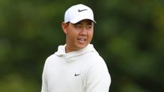 Tom Kim of South Korea smiles on the fourth tee during the Pro-Am prior to the Genesis Scottish Open at The Renaissance Club on July 10, 2024 in North Berwick, Scotland.