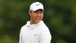 Tom Kim of South Korea smiles on the fourth tee during the Pro-Am prior to the Genesis Scottish Open at The Renaissance Club on July 10, 2024 in North Berwick, Scotland.