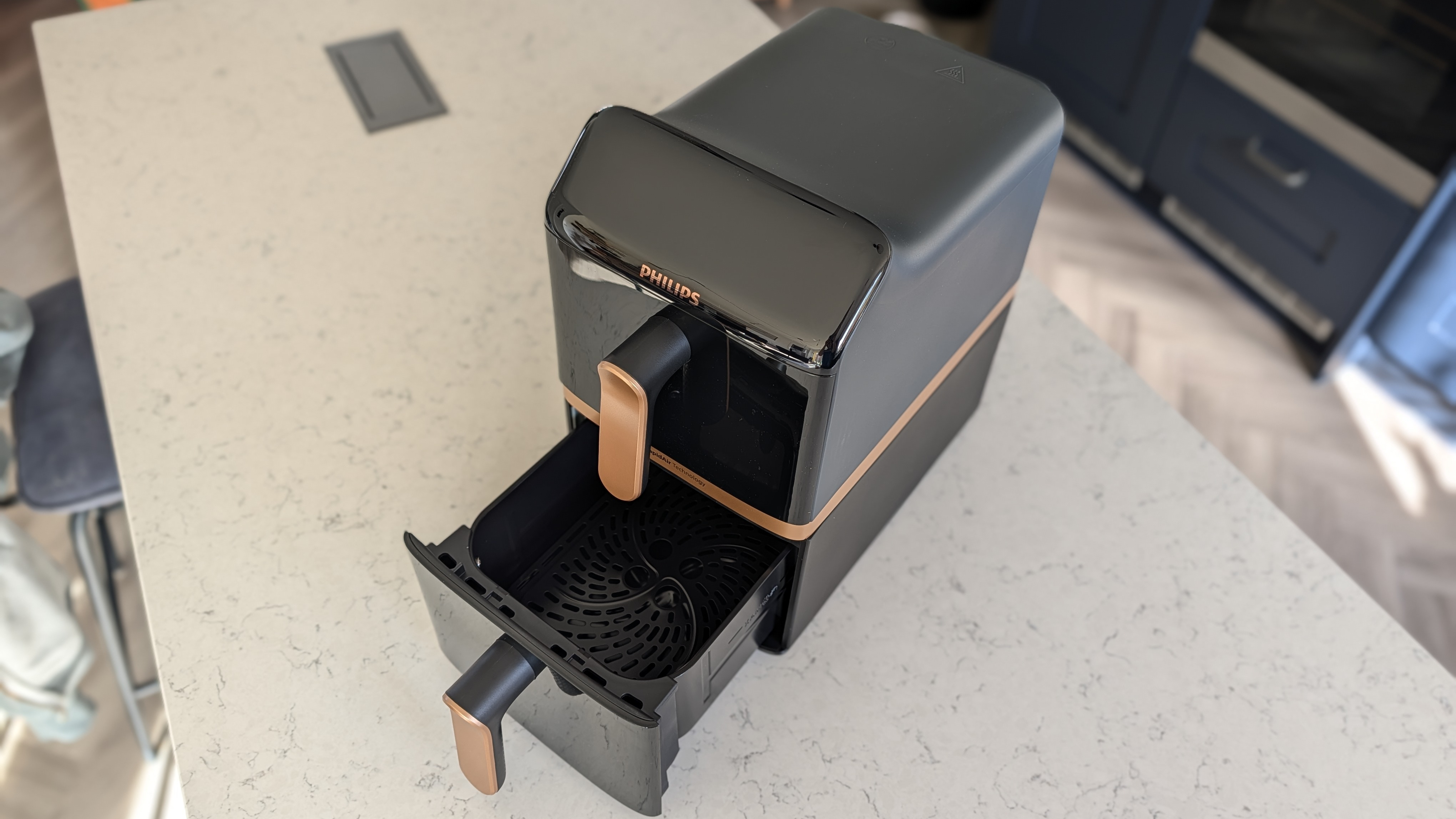 Philips 4000 Series Airfryer on kitchen counter with bottom drawer open