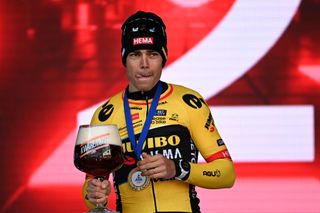 HARELBEKE BELGIUM MARCH 24 Wout Van Aert of Belgium and Team JumboVisma celebrates at podium as race winner enjoying a beer during the 66th E3 Saxo Bank Classic Harelbeke 2023 a 2041km one day race from Harelbeke to Harelbeke on UCIWT March 24 2023 in Harelbeke Belgium Photo by Tim de WaeleGetty Images