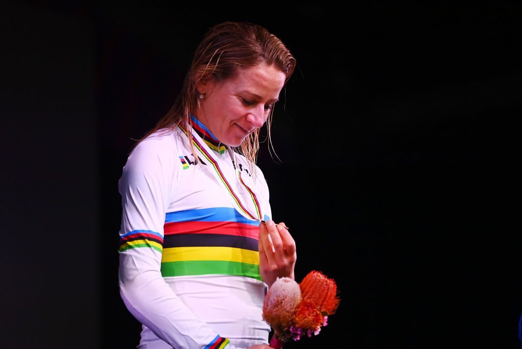 Annemiek van Vleuten admires her gold medal on podium after winning elite women&#039;s road race at 2022 World Championships in Wollongong