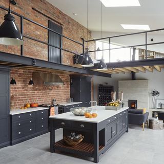 kitchen with brick wall and cabinets