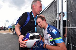 Wanty-Groupe Gobert soigneur comforts Dimitri Claeys after the race
