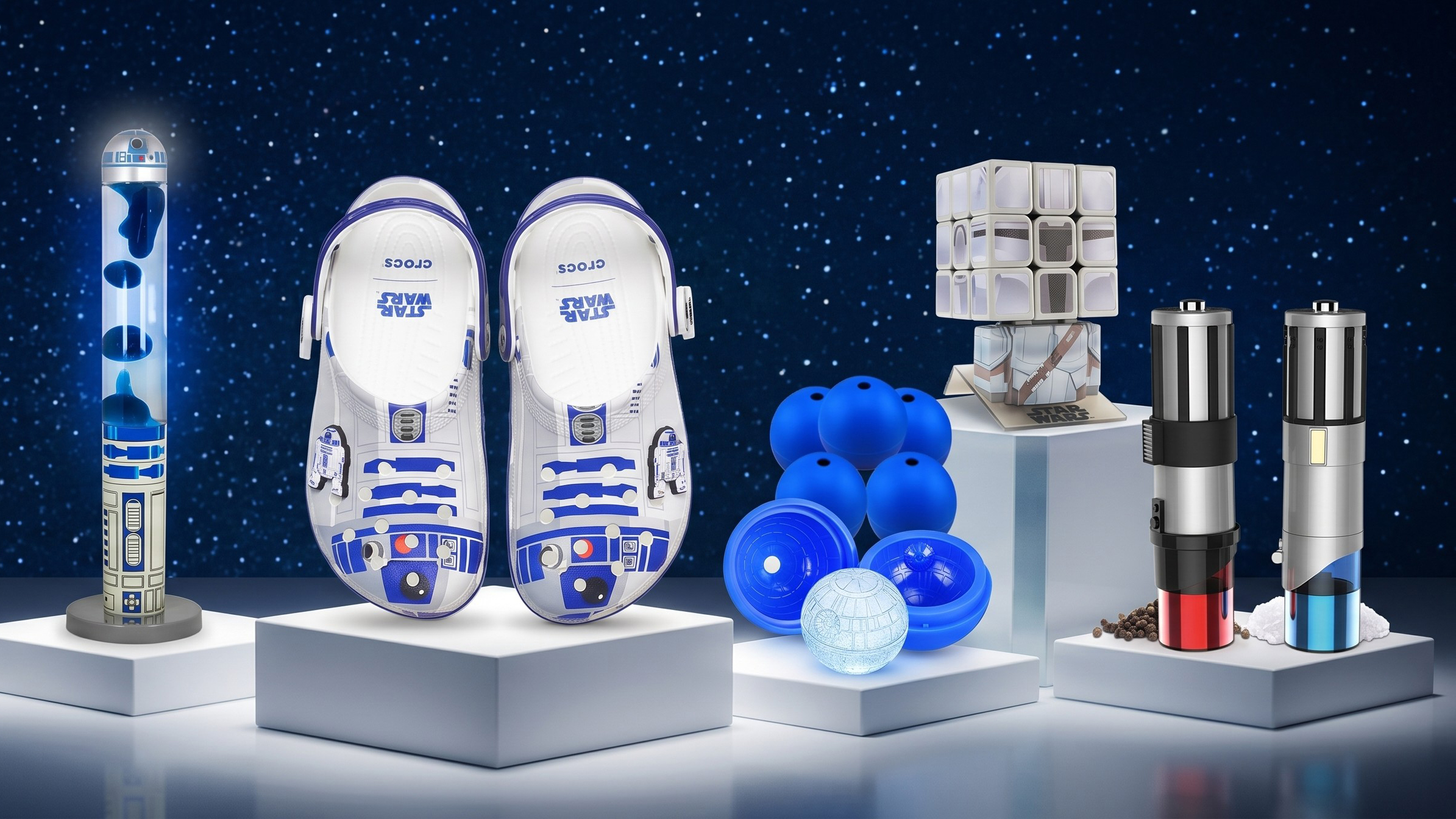 Selection of Star Wars themed merch, on podiums, with a starry background