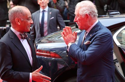 royal family response coronavirus shaking hands
