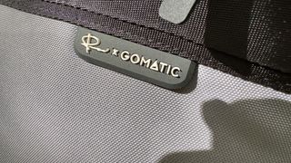 Close up of the logo on a Nomatic LUMA Camera Sling