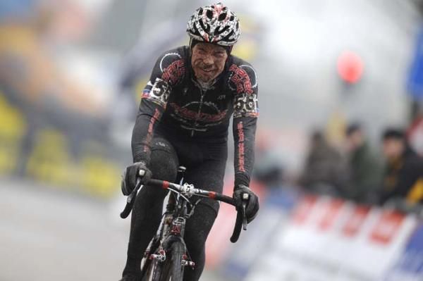 Jonathan Page smiles as he crosses the line in 8th.