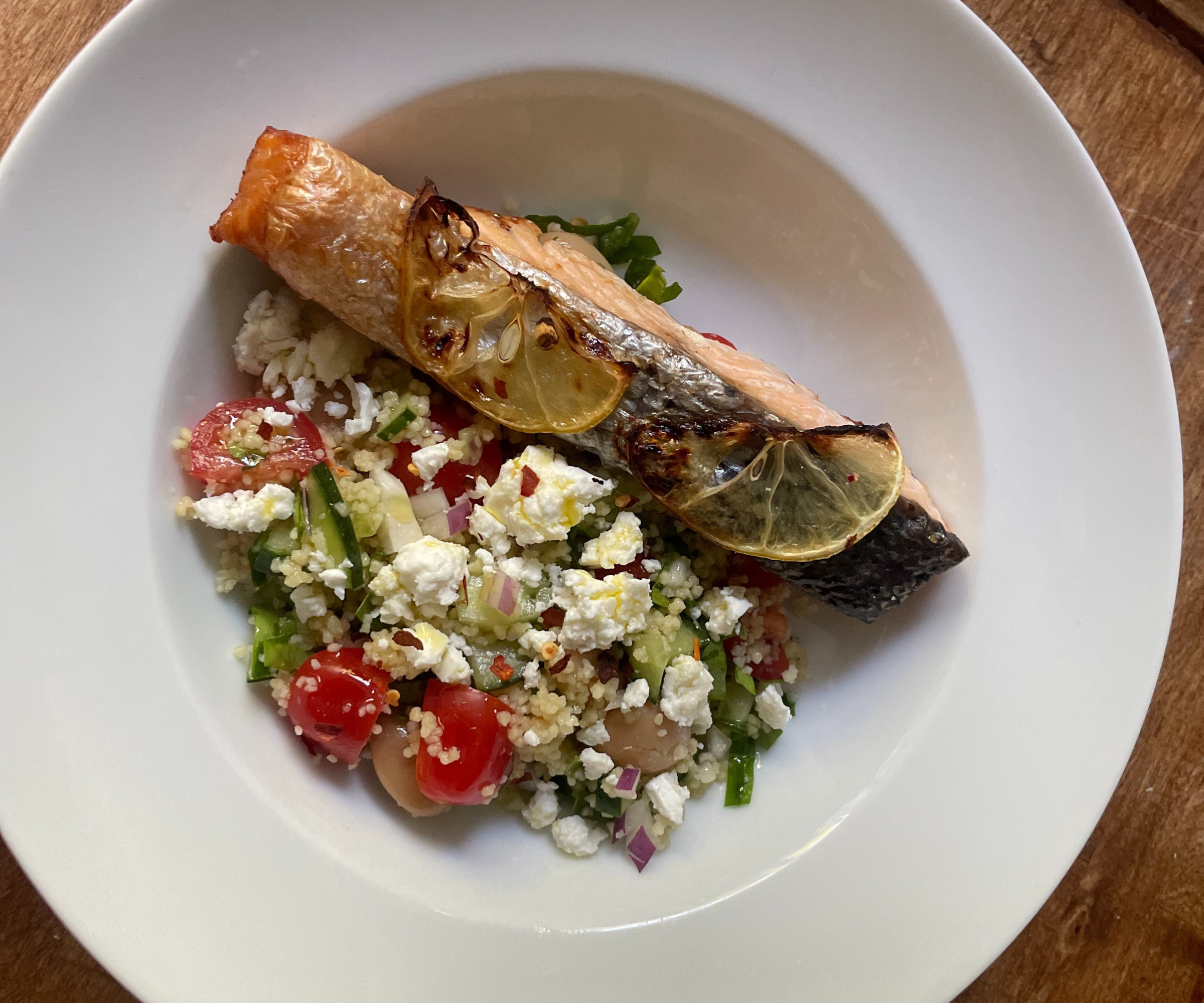 Lemon-baked salmon with a cous cous chopped salad, made with the HexClad knives