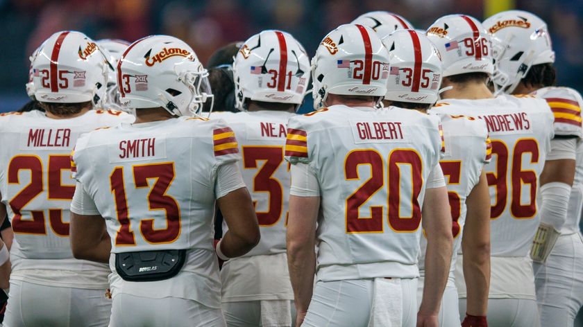 Iowa State Cyclones players huddle during a college football game