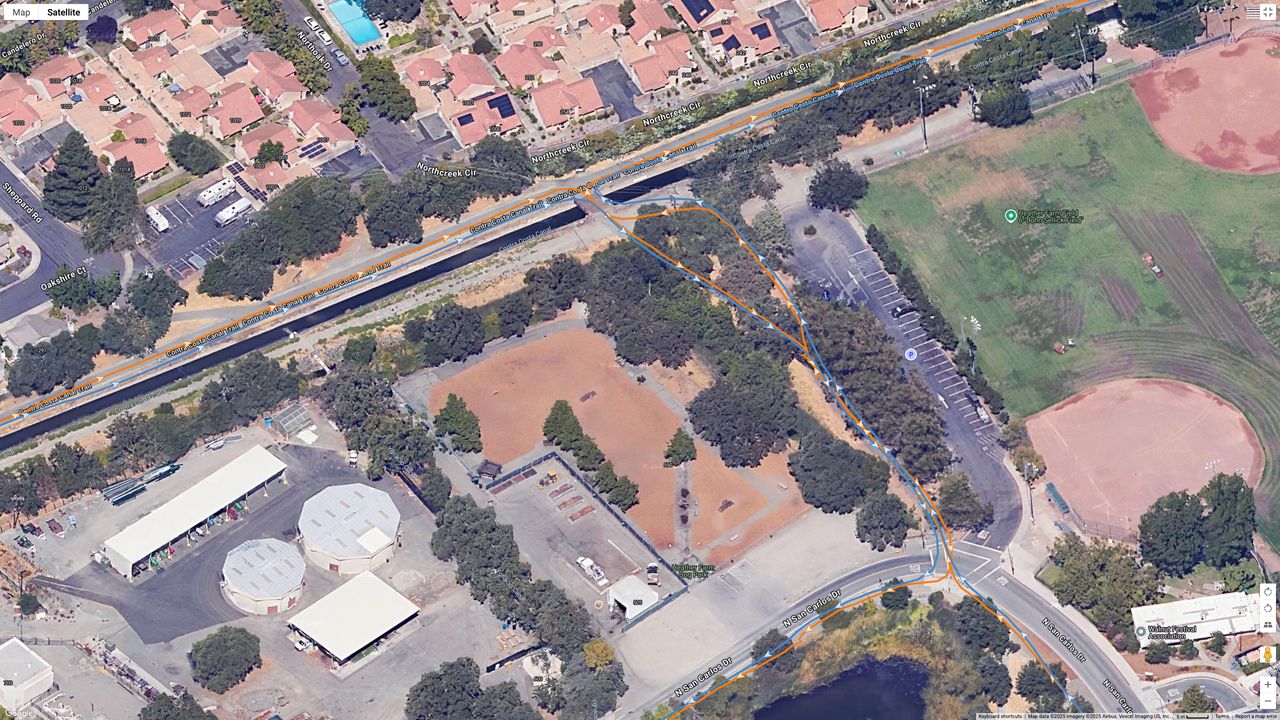 A Google Maps top-down view showing GPS lines for the Garmin Forerunner 970 (orange) and COROS PACE Pro (blue) indicating a running path.