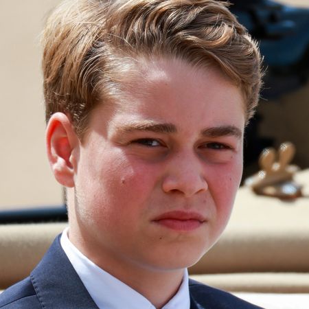 Prince George wears a navy suit with a white shirt and baby blue tie to attend Trooping the Colour 2026 at Buckingham Palace