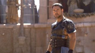 Russell Crowe standing in a gladiator pit in Gladiator