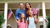 Family waving a flag in one of the PSAs available at the NAB Spot Center