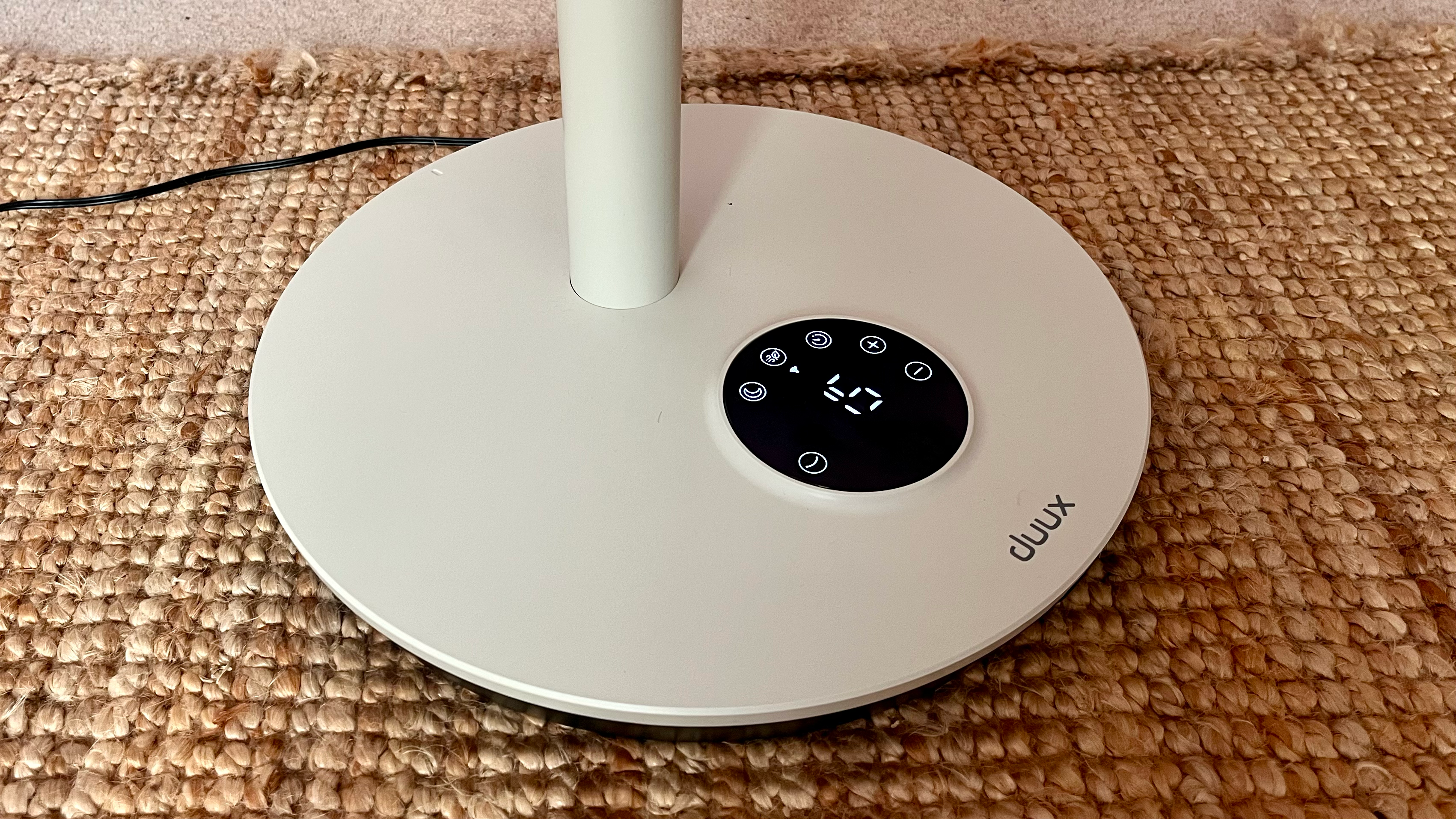 Duux Whisper Flex 2 fan on a pink background