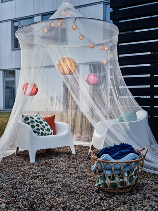 Cosy garden setup with mosquito net for protection