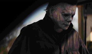 Halloween 2018 Michael Myers retrieves his mask from the trunk