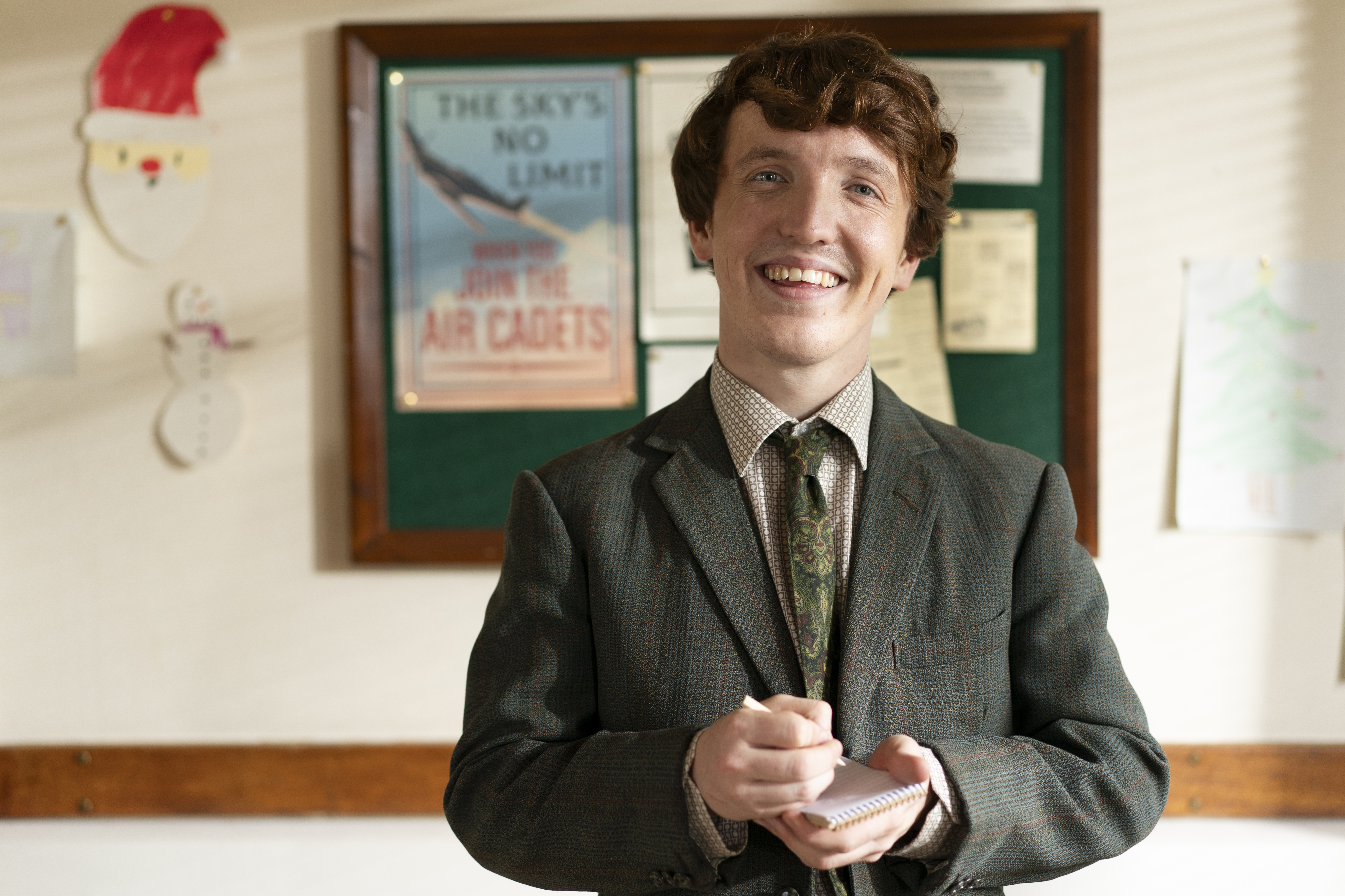 Norman Whalley with a pen and notepad in Sister Boniface Mysteries