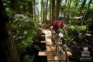 A rider on a wooden bridge at the BC Bike Race