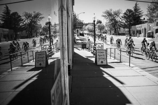 The men get strung out on the way down Main Street.