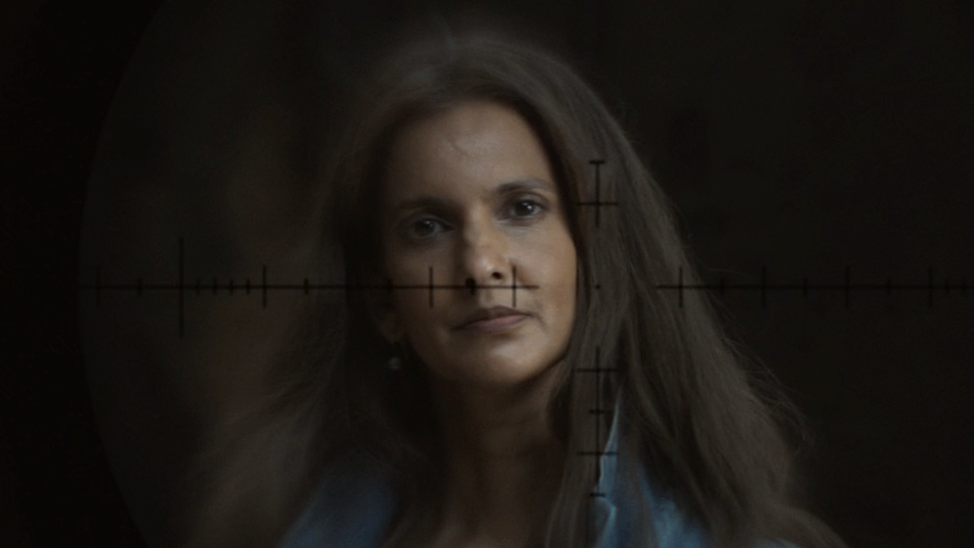 Zoe through sniper scope crosshairs in Lanterns Episode 5