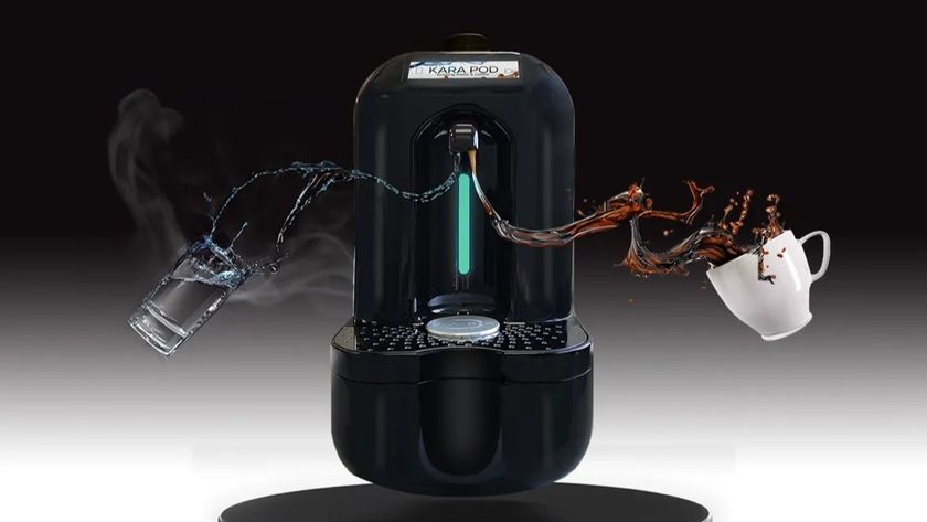 KaraPod coffee machine with cup of coffee and glass of water suspended beside it