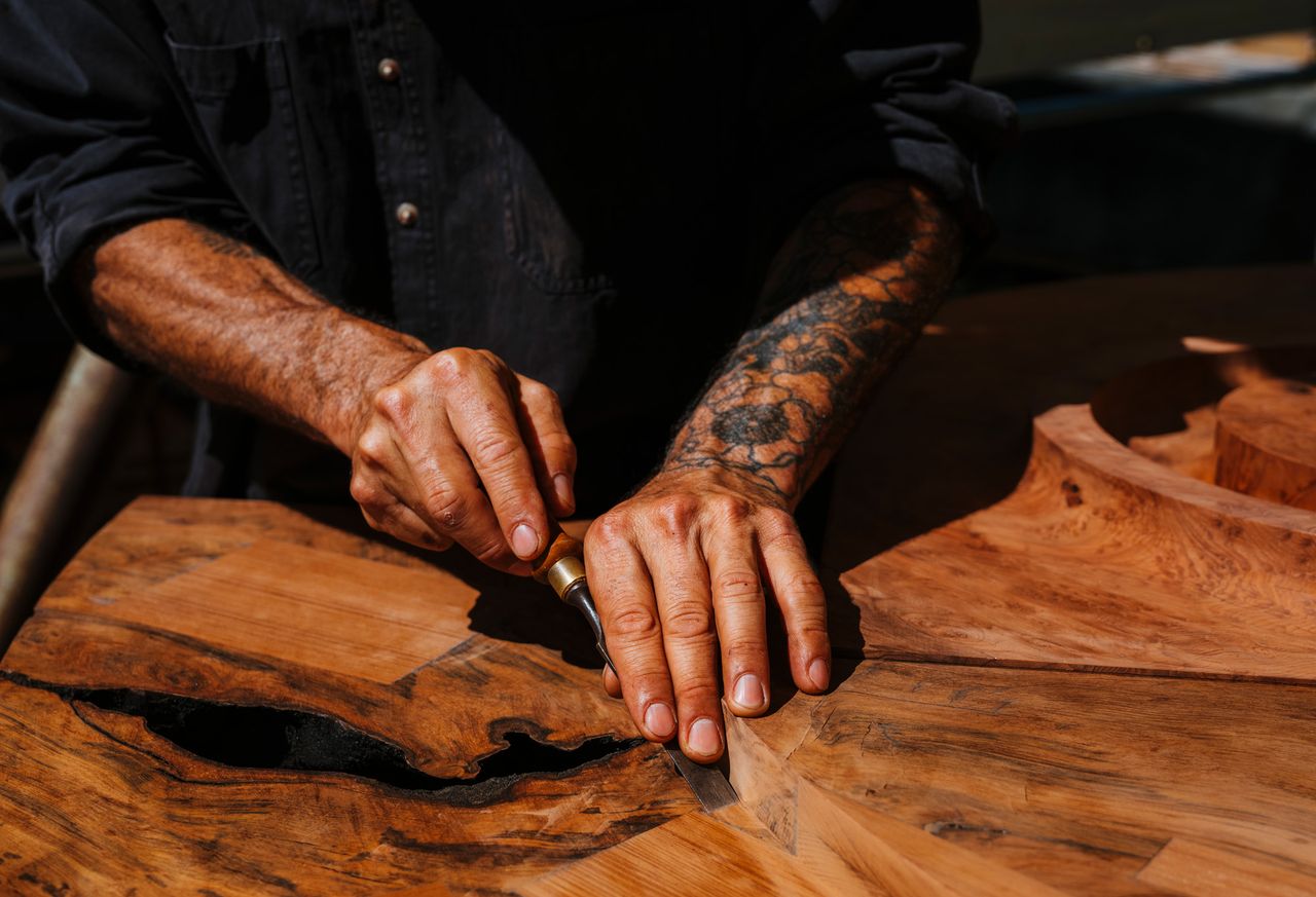 Ido Yoshimoto&#039;s workshop in California, photographed under a blue sky and with wooden elements from his production