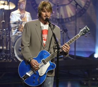 Charlie Colin performs onstage with Train on the Tonight Show with Jay Leno on June 23, 2003