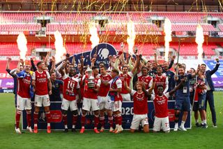 Arsenal players celebrate their FA Cup final win over Chelsea at an empty Wembley Stadium in August 2020.