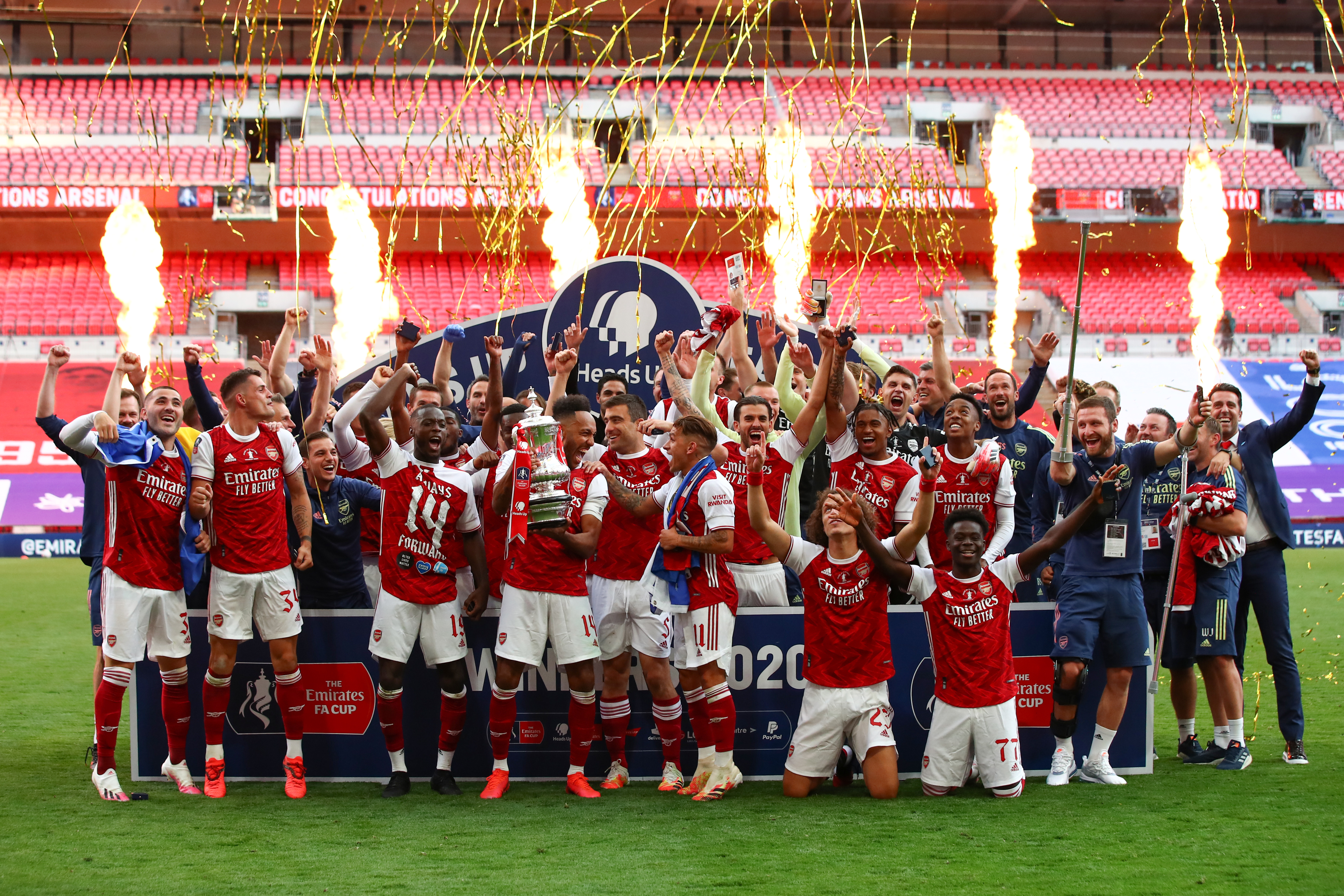 Arsenal players celebrate their FA Cup final win over Chelsea at an empty Wembley Stadium in August 2020.