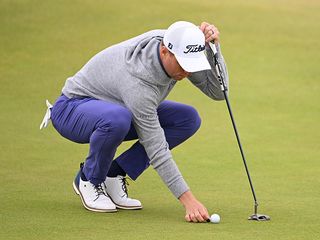 Justin Thomas reading a putt at Royal Troon